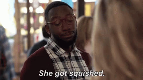 Man in Glasses and Plaid Shirt Talking to Woman Saying She Got Squished