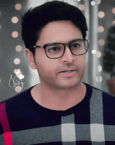 Man in Glasses and Plaid Shirt with Name Neha
