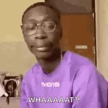 Man In Glasses And Purple Shirt Making A Face GIF
