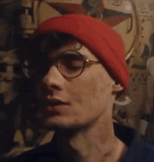 Man in Glasses and Red Beanie Saying Been Thinking About You