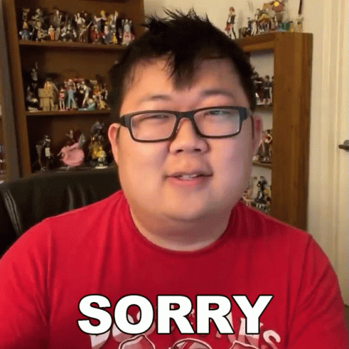 Man in Glasses and Red Shirt Saying Sorry