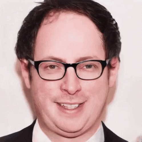 Man In Glasses And Suit Close Up GIF