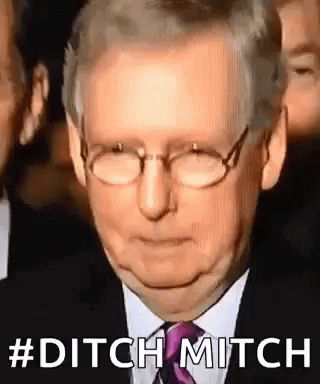 Man in Glasses and Suit Ditch Mitch