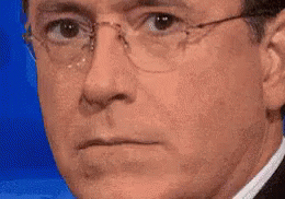 Man in Glasses and Suit Making Face
