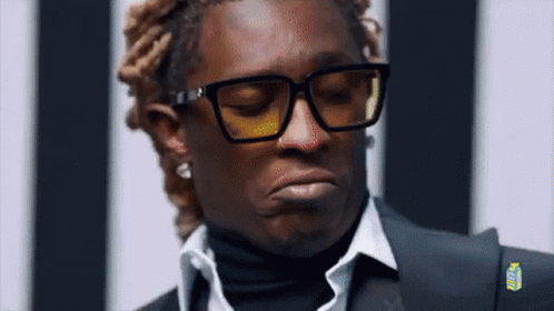 Man In Glasses And Suit Making Funny Face GIF