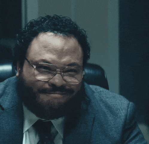 Man in Glasses and Suit Saying Semi-Gloss