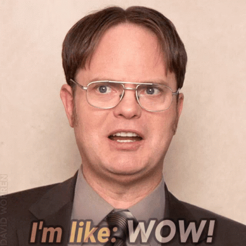 Man in Glasses and Suit Saying Wow