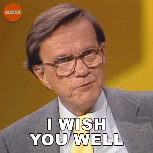 Man in Glasses and Suit Says I Wish You Well