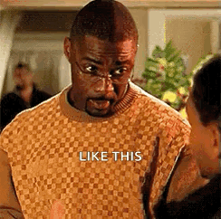 Man in Glasses and Sweater Saying Like This