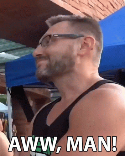 Man in Glasses and Tank Top Saying Aww Man