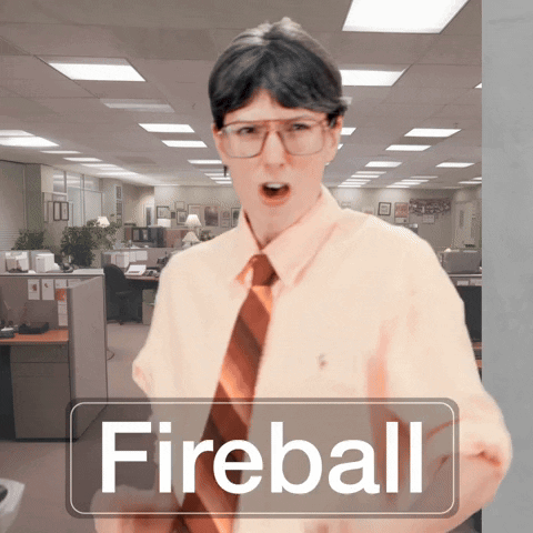 Man in Glasses and Tie in Office with Fireball Sign