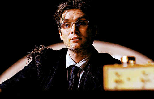 Man in Glasses and Tie Looking Up