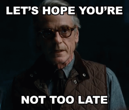 Man in Glasses and Vest Says Let's Hope You're Not Too Late