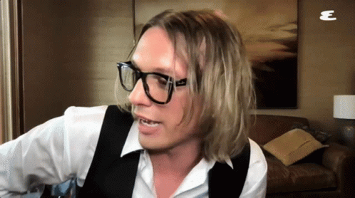 Man In Glasses And Vest With Letter E GIF