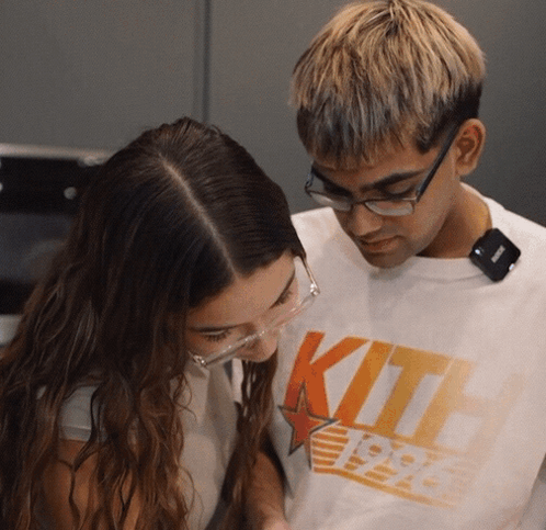 Man in Glasses and White Kith Shirt