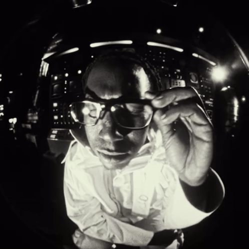 Man In Glasses And White Shirt Looking At Camera GIF