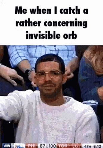 Man In Glasses And White Sweater Sitting In Crowd GIF