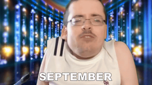 Man in Glasses and White Tank Top Saying September