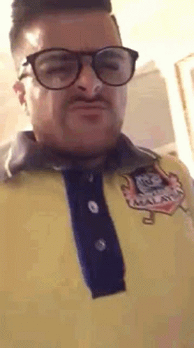 Man in Glasses and Yellow Shirt