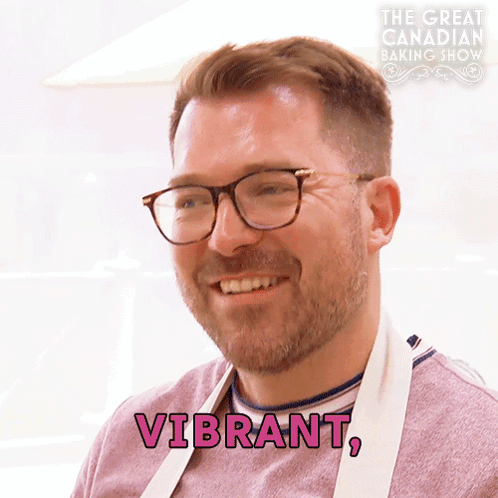 Man In Glasses Apron Says Vibrant In Pink GIF