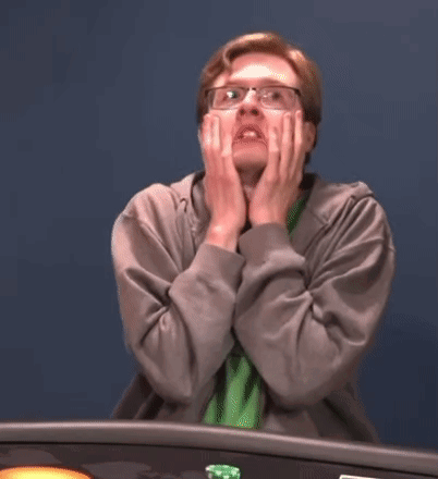 Man In Glasses Covering Face Playing Poker GIF