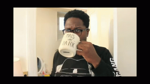 Man In Glasses Drinking From Mug Saying Mais Day I'm Ok GIF