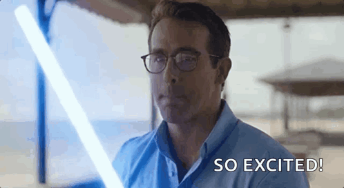 Man in Glasses Holding Lightsaber