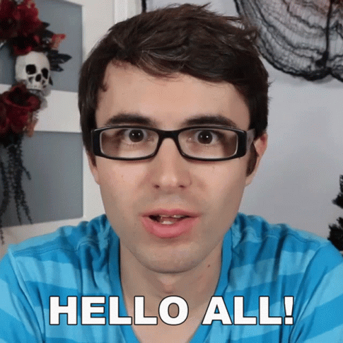 Man In Glasses Saying Hello All In Front Of Skull Wreath GIF