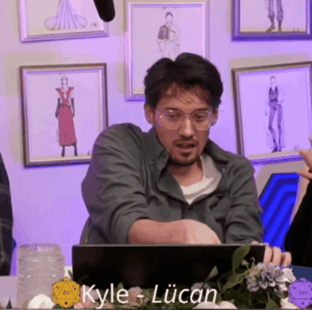 Man in Glasses Sitting at Laptop With Kyle Lucan on Screen
