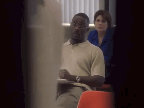 Man in Glasses Sitting in Classroom