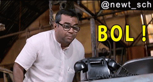 Man in Glasses Talking on Phone With Yellow Bol