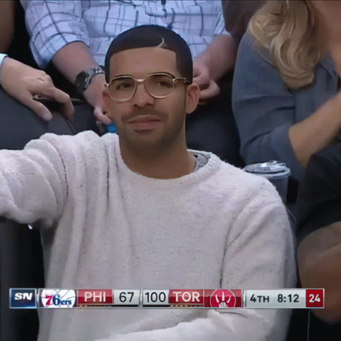Man in Glasses Watching 76ers vs Raptors