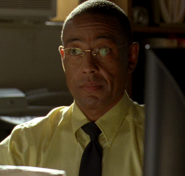 Man In Glasses Yellow Shirt And Tie Looking At Camera GIF