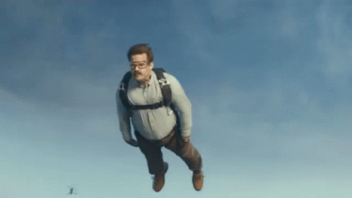 Man in Goggles and Backpack Flying
