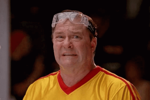 Man in Goggles and Yellow Striped Shirt Making Face