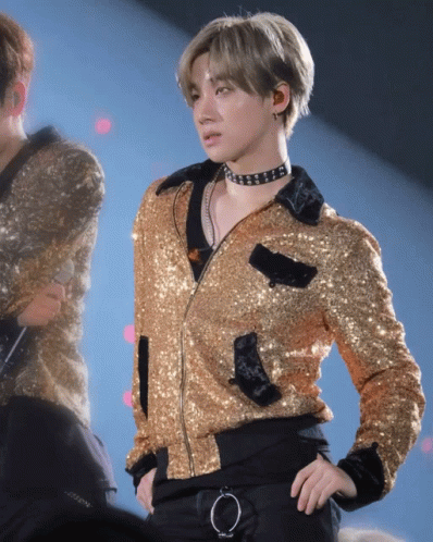 Man In Gold Jacket And Choker On Stage GIF