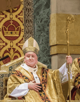 Man in Gold Robe Holding Cane Beside Crown
