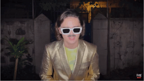 Man In Gold Suit And White Sunglasses GIF