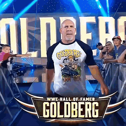 Man in Goldberg Shirt in Front of WWE Hall of Fame Sign
