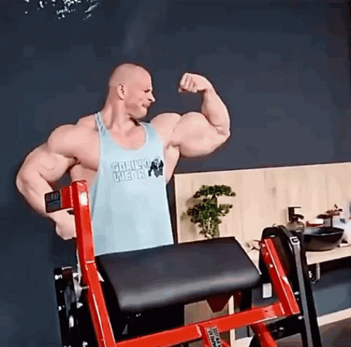 Man in Gorilla Wear Tank Top Flexing Biceps