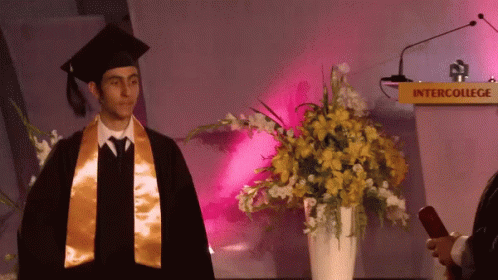 Man In Graduation Cap And Gown GIF