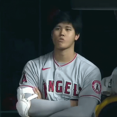 Man in Gray Angels Jersey With Arms Crossed