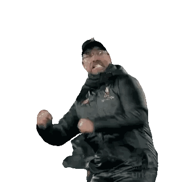 Man in Gray Jacket Dancing