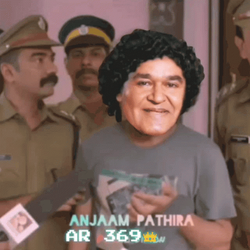Man in Gray Shirt Anjaam Pathira