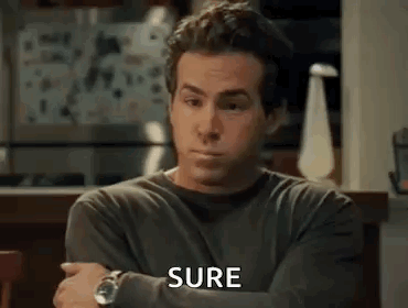 Man in Gray Shirt Sitting With Arms Crossed Saying Sure