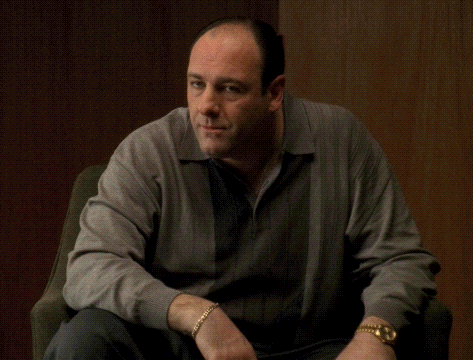 Man in Gray Sweater and Gold Watch Sitting
