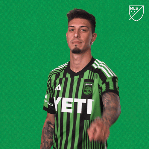 Man In Green And Black Striped Jersey Saying Yeti GIF