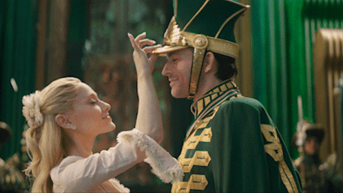 Man in Green and Gold Uniform Dancing with Lady