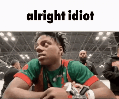 Man in Green and Red Shirt Saying Alright Idiot