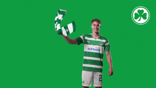 Man in Green and White Hofmann Shirt Holding Scarf